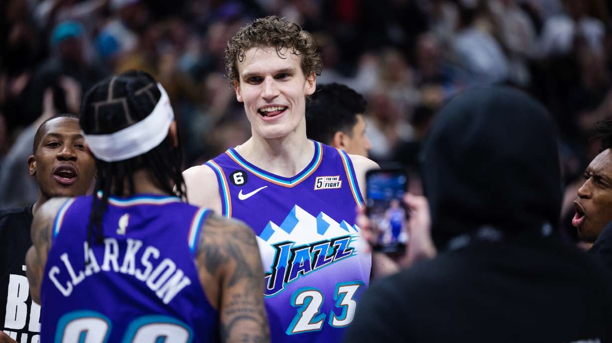 Utah Jazz forward Lauri Markkanen (23) celebrates with Utah Jazz guard Jordan Clarkson (00) after his game-winning free throw in overtime during an NBA game at Vivint Arena in Salt Lake City on Feb. 23, 2023.