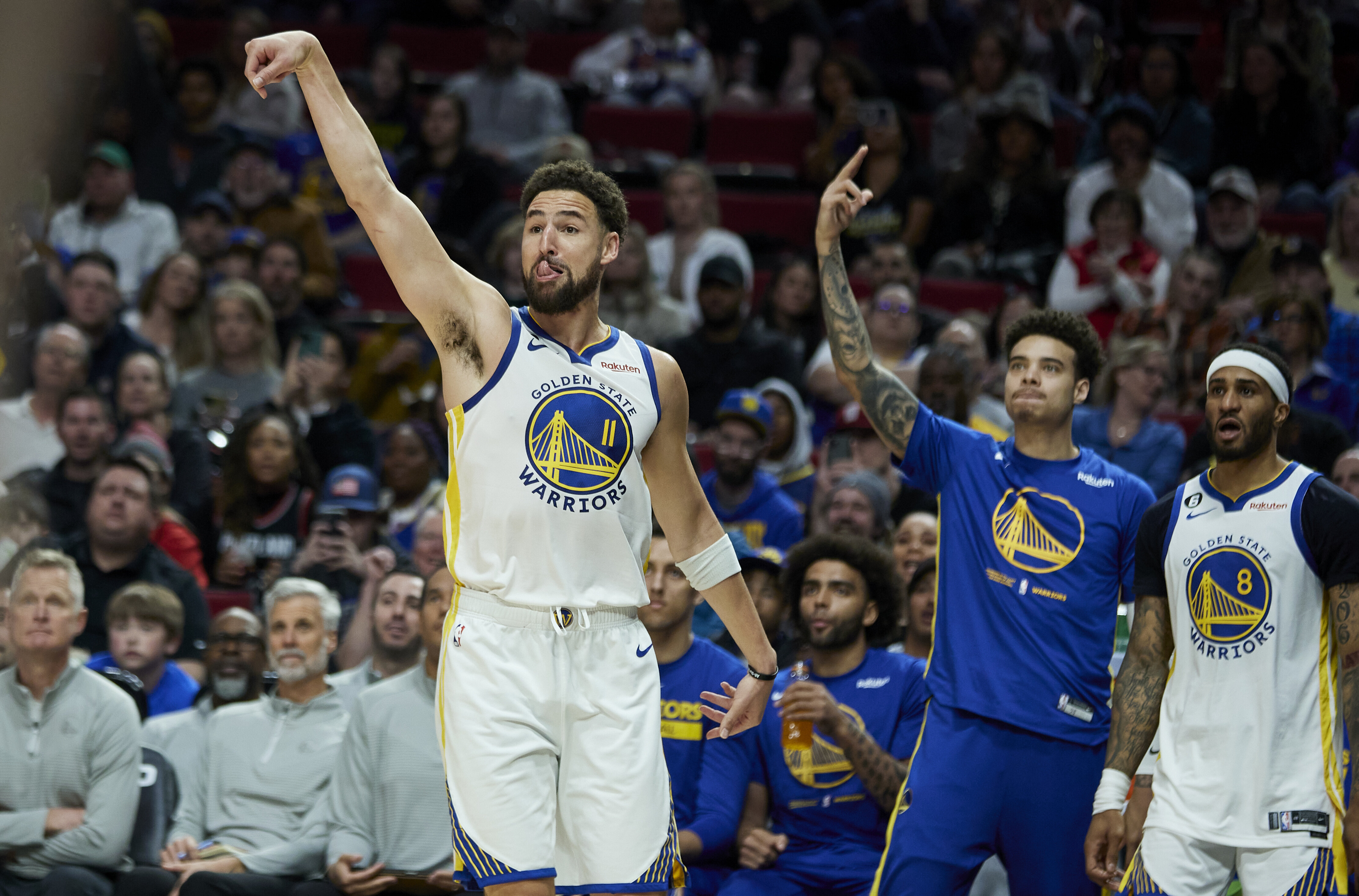 Golden State Warriors guard Klay Thompson reacts after making a 3-point basket against the Portland Trail Blazers during the second half of an NBA basketball game in Portland, Ore., Sunday, April 9, 2023. 