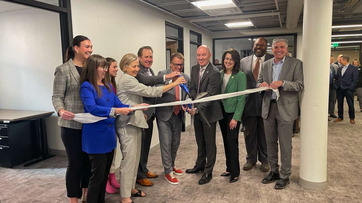 Policy, government and education leaders from around Utah cut the ribbon at the opening of the Utah Policy Innovation Lab at the Thomas S. Monson Building in Salt Lake City on Monday. Along with the opening of the lab, Utah Gov. Spencer Cox ceremonially signed seven different bills aimed at fostering innovation in Utah.