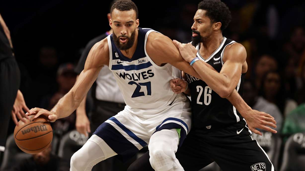 Minnesota Timberwolves center Rudy Gobert (27) drives to the basket against Brooklyn Nets guard Spencer Dinwiddie during the second half of an NBA basketball game, Tuesday, April 4, 2023, in New York.