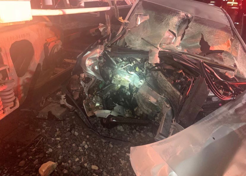 A woman is in critical condition after her car collided with a train near Deweyville early Sunday.