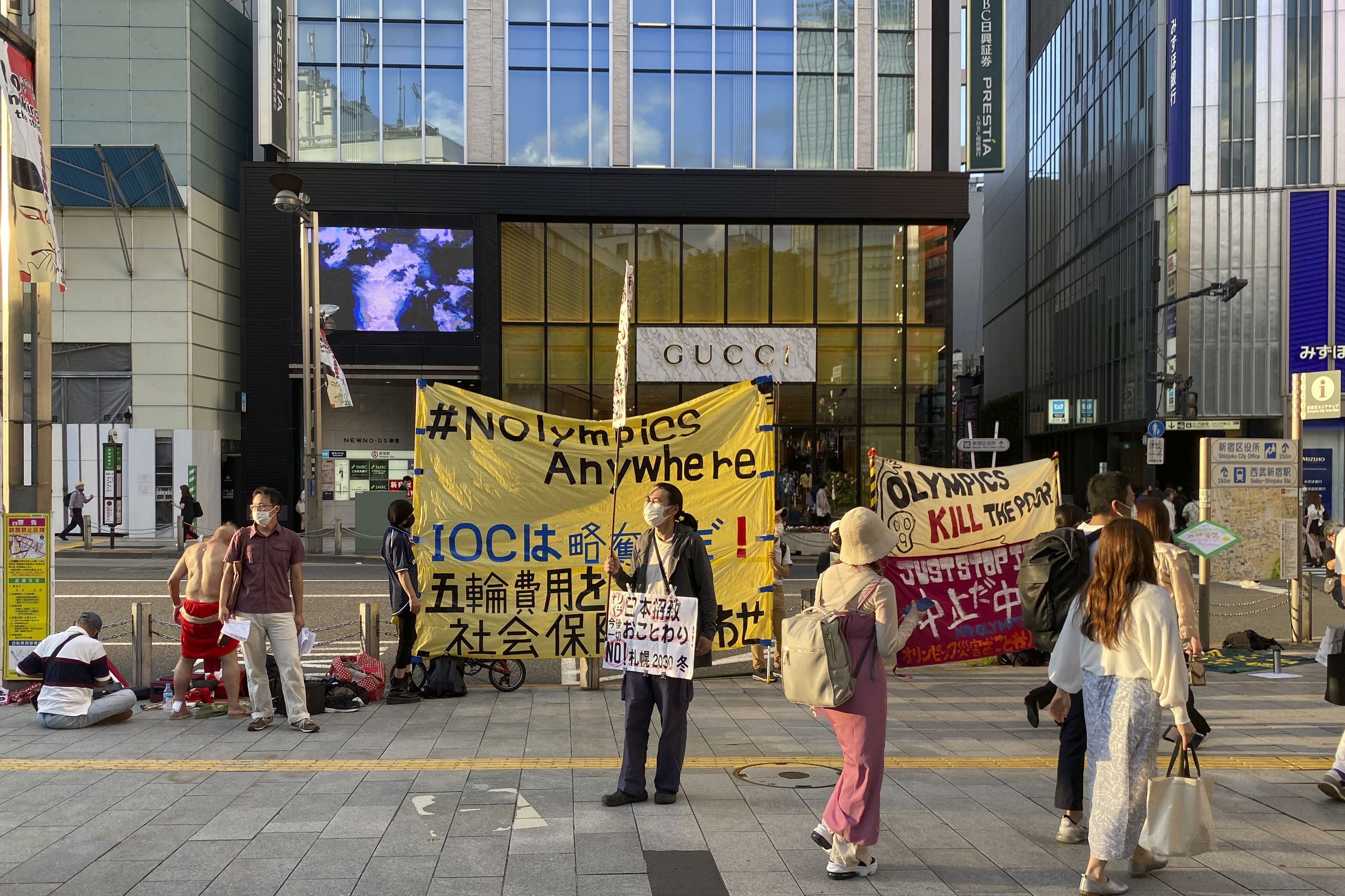 Protesters stage a rally against Japan’s Sapporo 2030 Olympics bid, in Shinjuku district of Tokyo, Japan, June 12, 2022. Holding “No Olympics” banners, protesters demanded Japan drop its bid for the 2030 Winter Games.