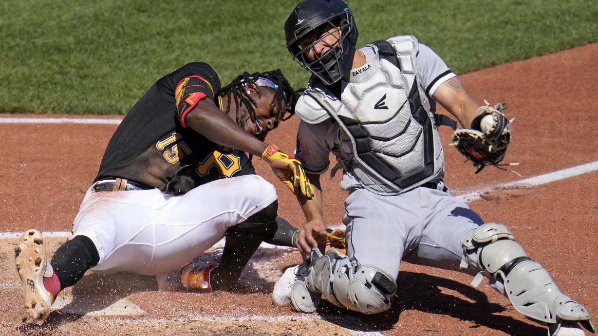 Pittsburgh Pirates' Oneil Cruz (15) is injured as he is tagged out attempting to score by Chicago White Sox catcher Seby Zavala during the sixth inning of a baseball game in Pittsburgh, Sunday, April 9, 2023. A bench clearing brawl ensued as a result of the play. The Pirates won 1-0.