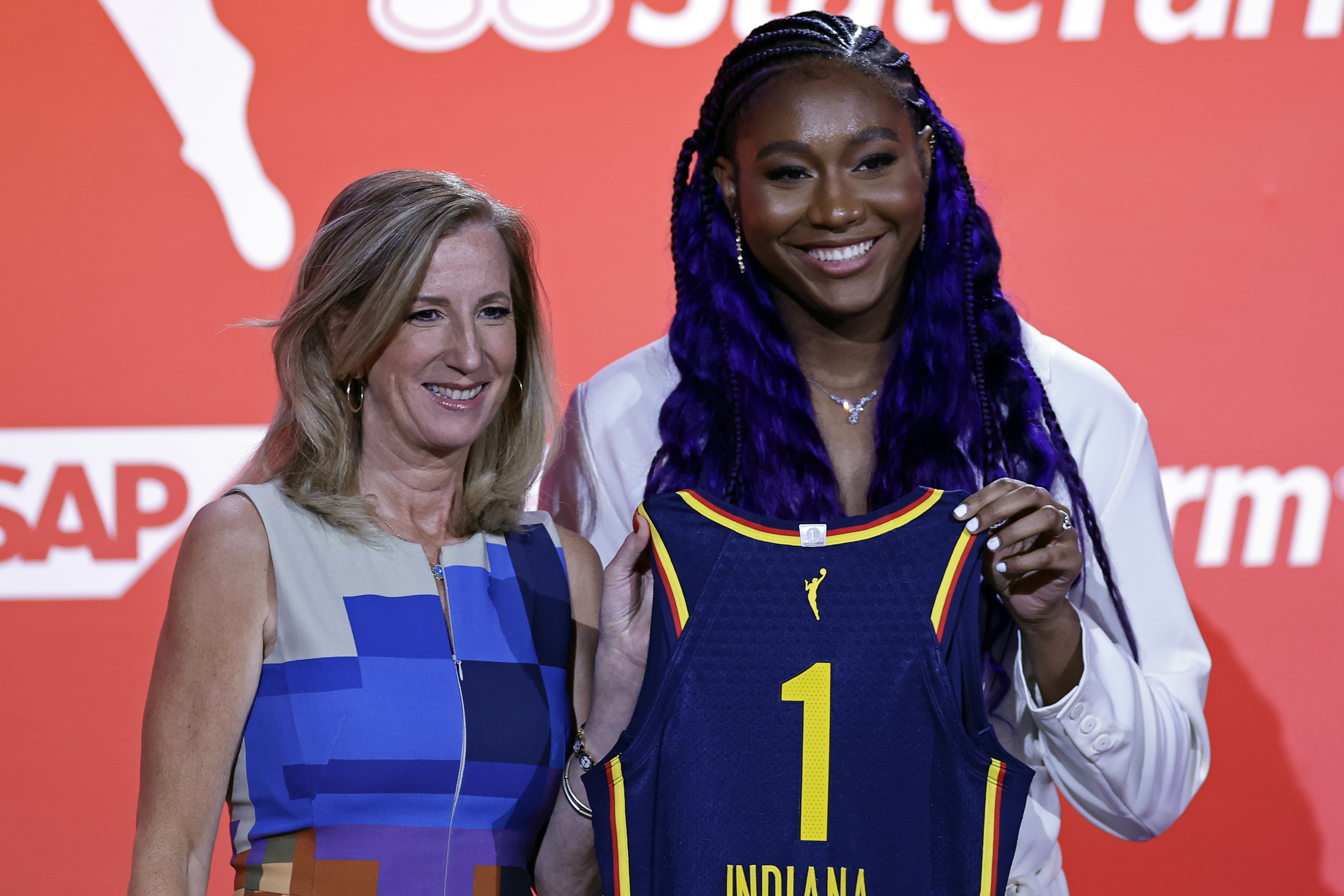 South Carolina's Aliyah Boston, right, poses for a photo with commissioner Cathy Engelbert after the Indiana Fever selected her first overall at the WNBA basketball draft Monday, April 10, 2023, in New York. 