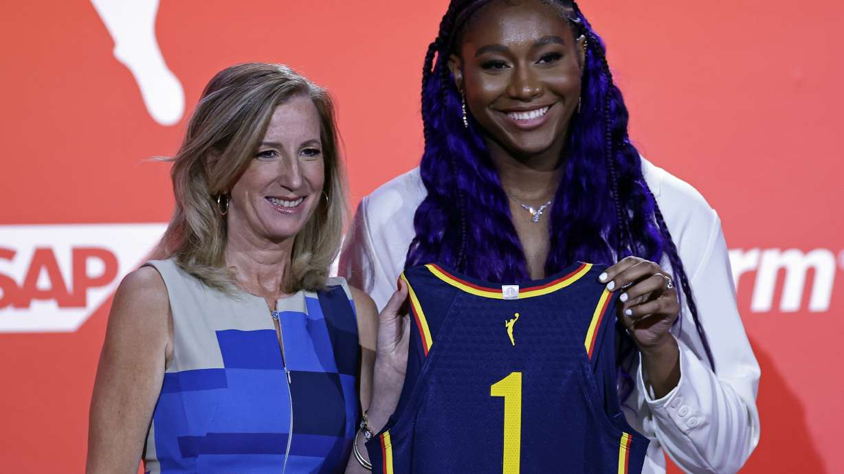 South Carolina's Aliyah Boston, right, poses for a photo with commissioner Cathy Engelbert after the Indiana Fever selected her first overall at the WNBA basketball draft Monday, April 10, 2023, in New York.