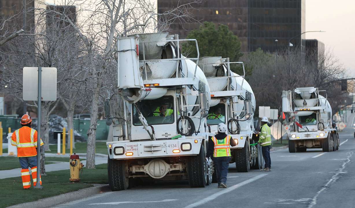 Trucks wait in line to pour concrete at the Salt Lake Temple of The Church of Jesus Christ of Latter-day Saints in Salt Lake City on Tuesday, during an all-night pour.