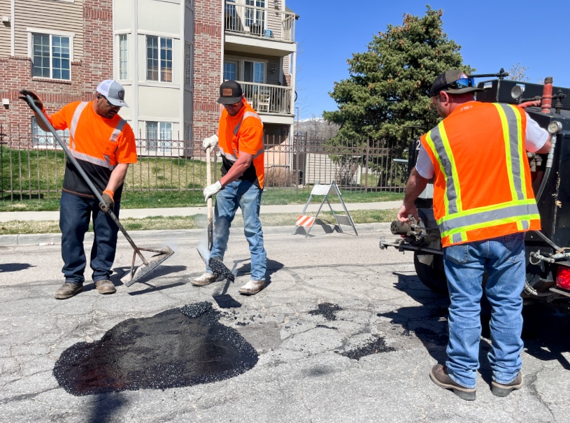 Salt Lake City Streets Division employees fill in a large pothole on Fremont Avenue in Salt Lake City Tuesday afternoon. It is one of thousands that are expected to be filled in this week.