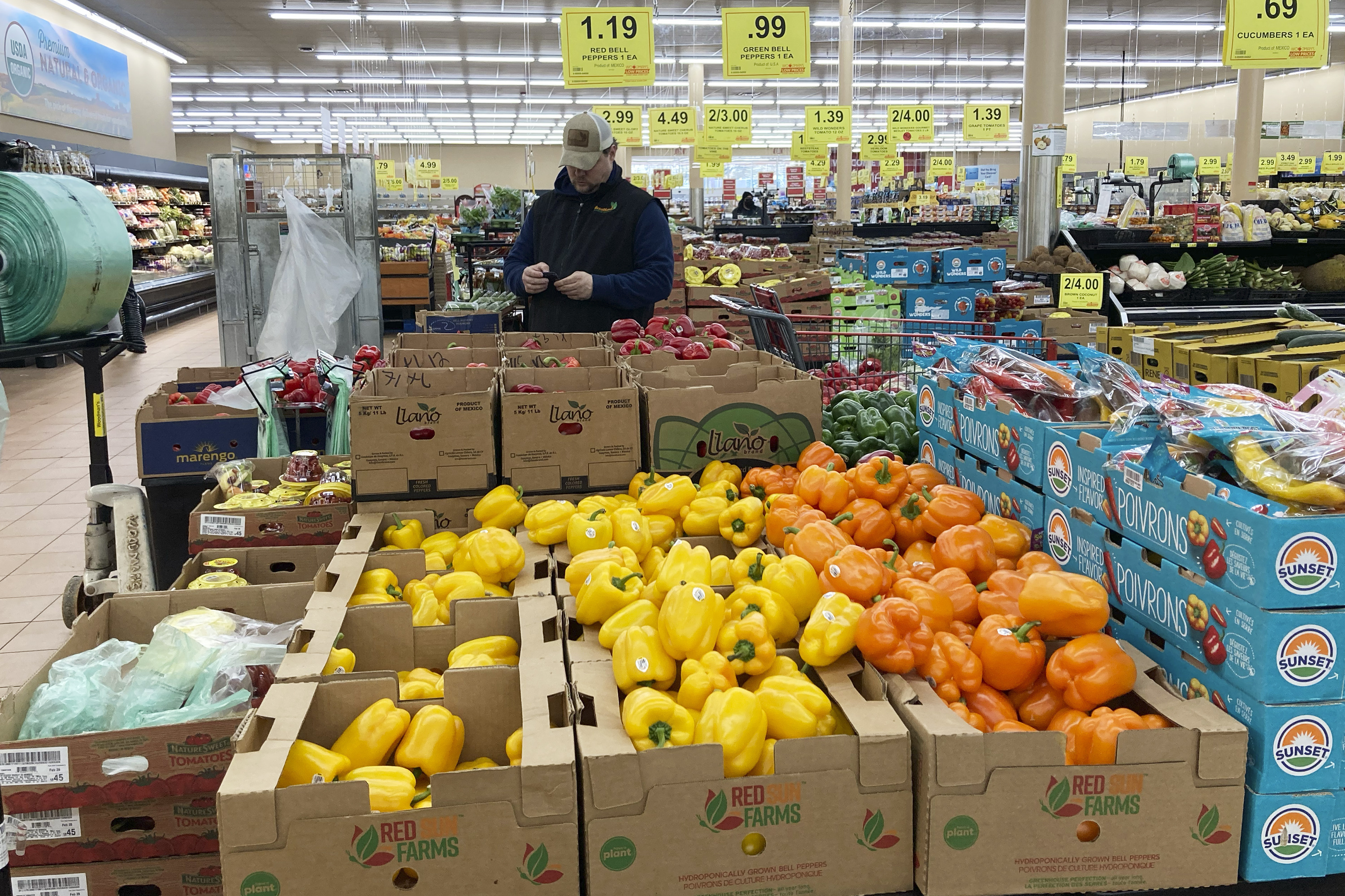 A man shops at a grocery store in Buffalo Grove, Ill., March 19. U.S. consumer inflation eased in March, with less expensive gas and lower food prices, the Labor Department reported Wednesday.