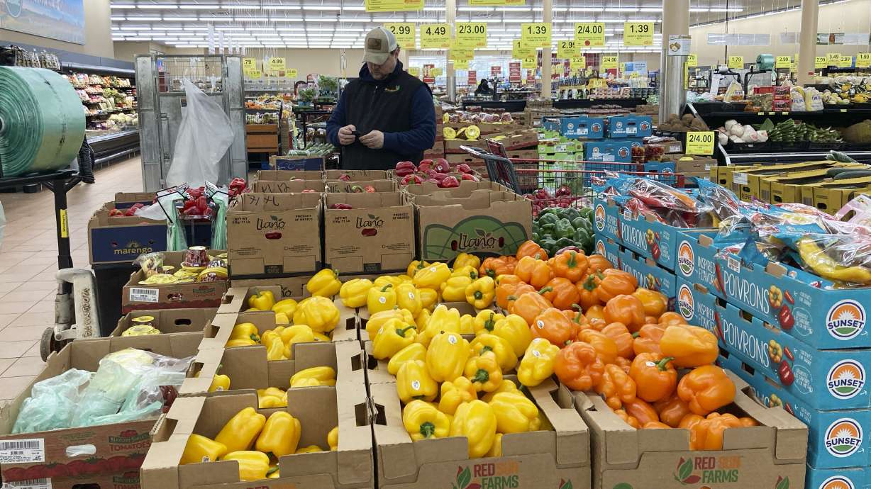 A man shops at a grocery store in Buffalo Grove, Ill., March 19. U.S. consumer inflation eased in March, with less expensive gas and lower food prices, the Labor Department reported Wednesday.