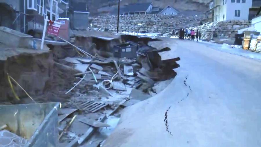 Orchard Ridge Lane in Kaysville collapsed early Wednesday under the pressure of increased spring runoff.