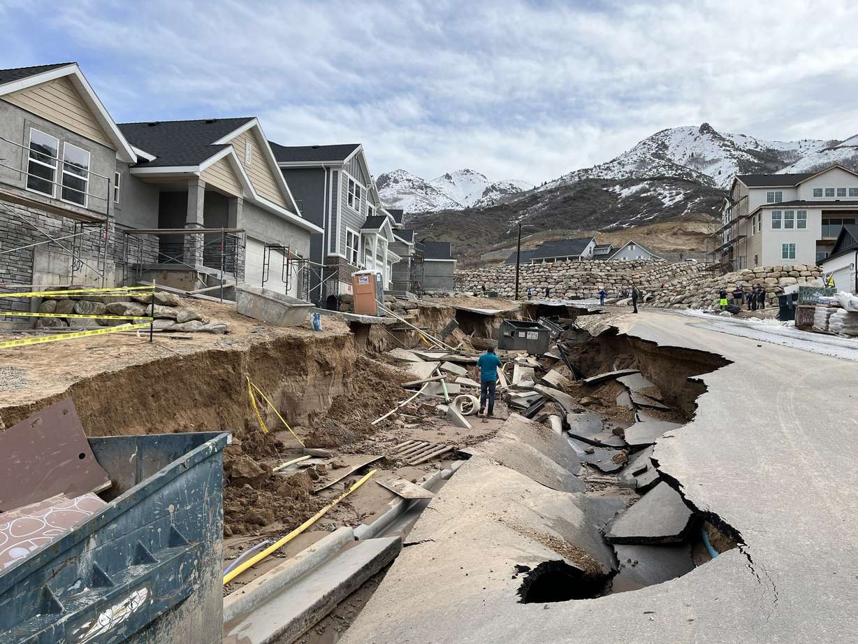 A street damaged by flooding in Kaysville is pictured on April 12.
