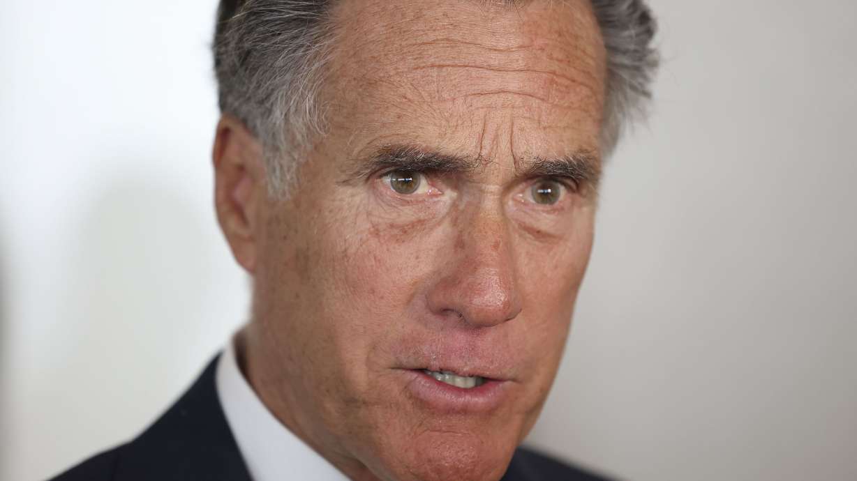 Sen. Mitt Romney speaks to reporters following an event with the Utah Aerospace and Defense Association at the Larry H. Miller Company in Sandy on Feb. 23. Romney may have dropped a clue Tuesday about whether or not he will run for reelection in 2024.