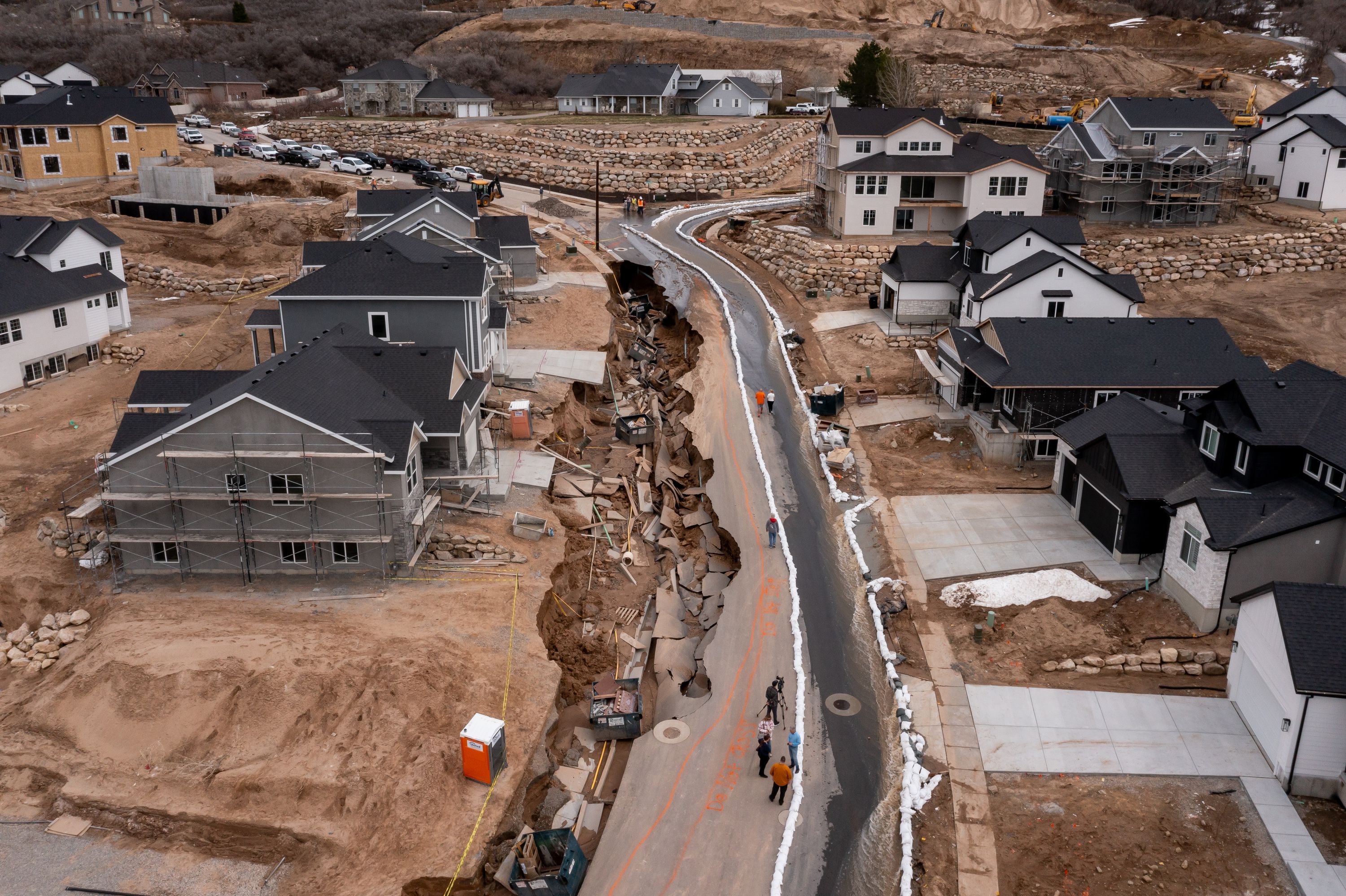 A sinkhole caused by flooding from spring runoff is seen on Orchard Ridge Lane in Kaysville on Wednesday.
