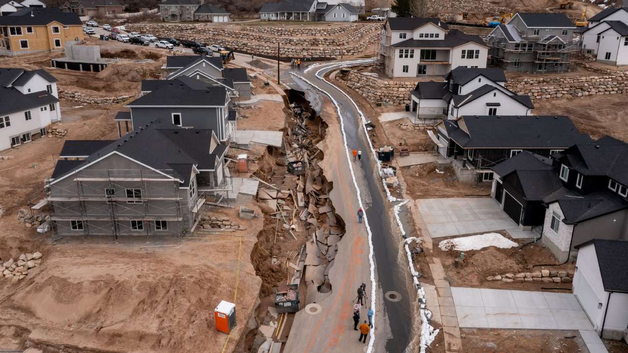 A sinkhole caused by flooding from spring runoff is seen on Orchard Ridge Lane in Kaysville on Wednesday.