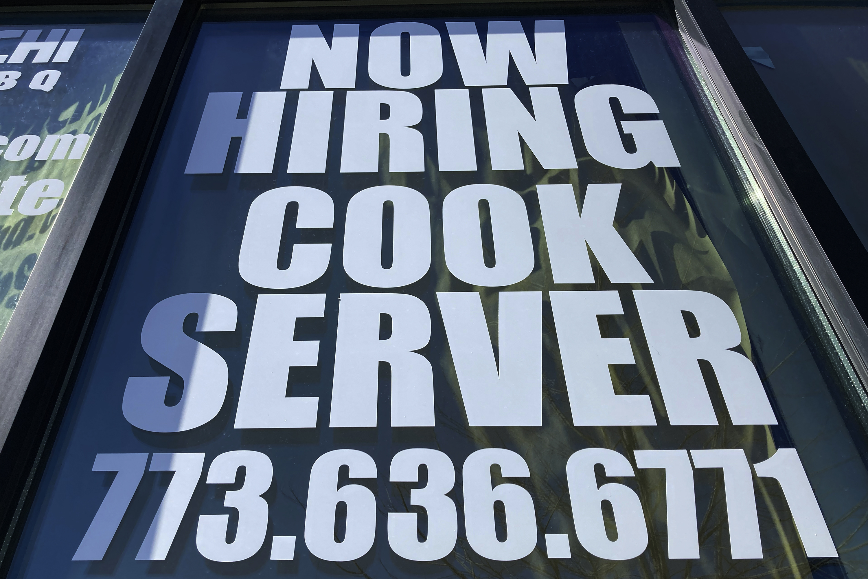 A hiring sign at a restaurant in Mount Prospect, Ill., March 19. The U.S. Labor Department on Thursday reported an increase in jobless claims.