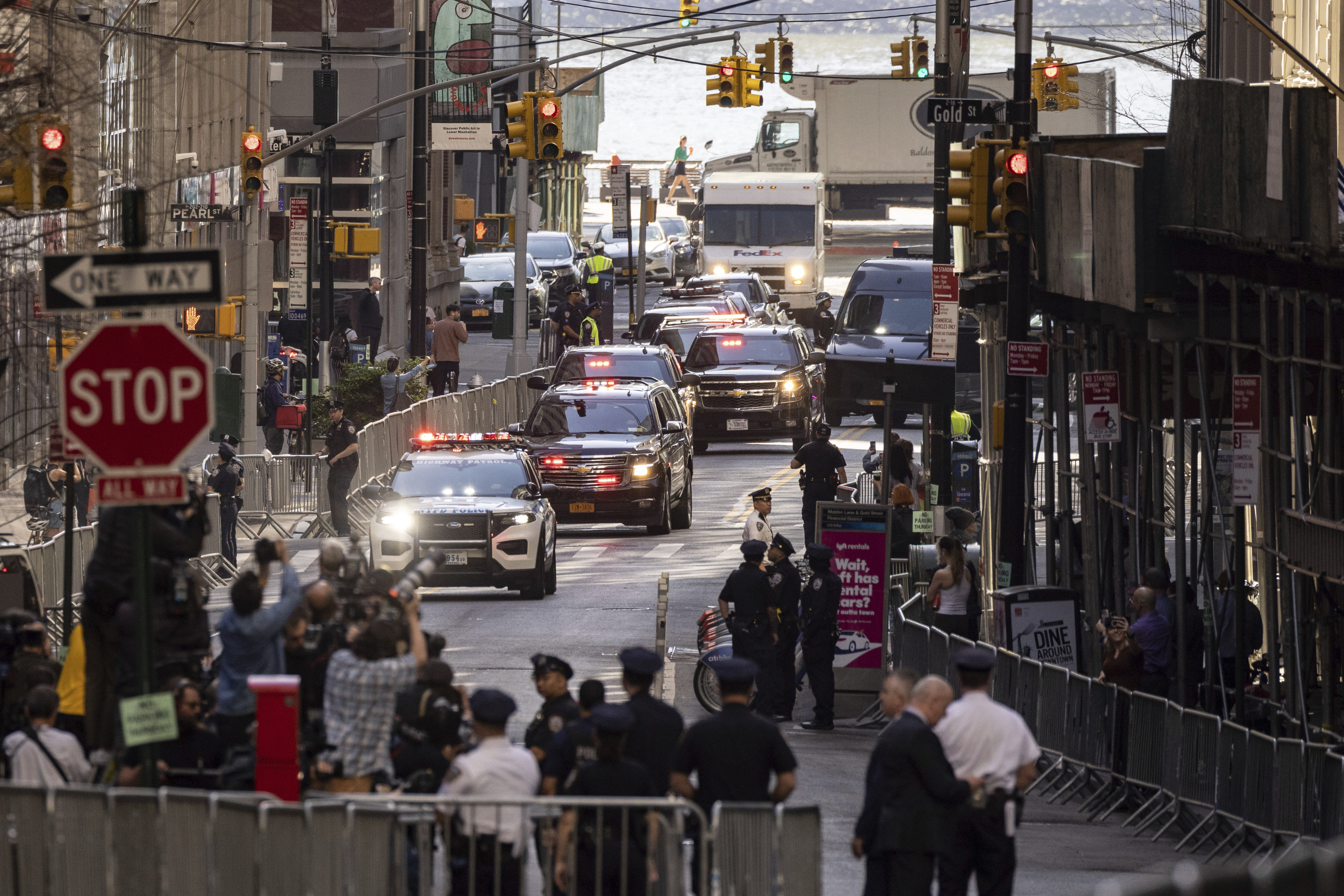 The motorcade of former President Donald Trump arrives at an Attorney General's office building for depositions in a civil investigation in New York, Thursday. Trump is scheduled to meet with lawyers for Attorney General Letitia James, who sued Trump last year.