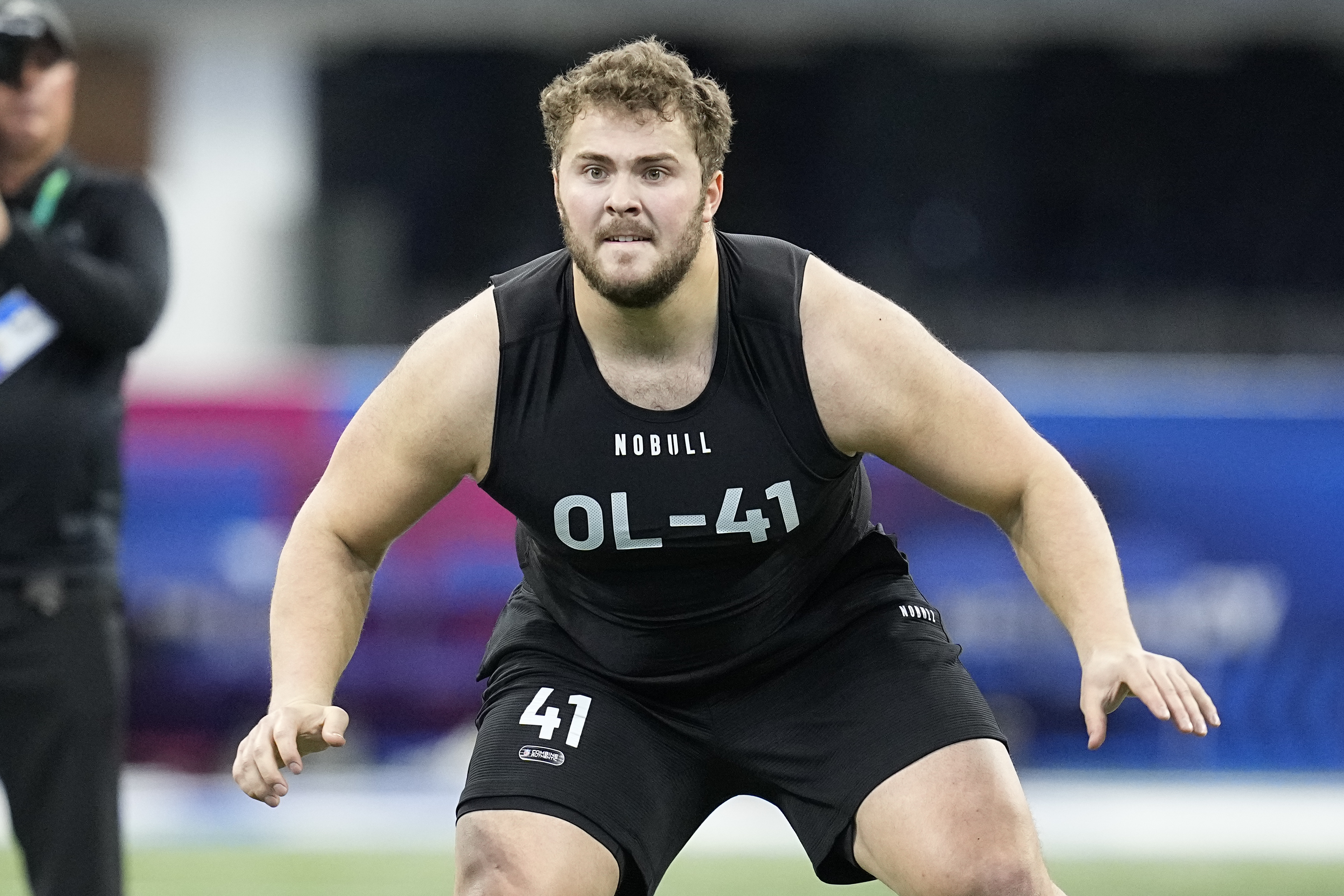 FILE - Northwestern offensive lineman Peter Skoronski runs a drill at the NFL football scouting combine in Indianapolis, Sunday, March 5, 2023. Skoronski looks like a custom-built NFL offensive lineman. 