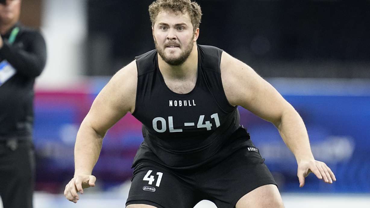 FILE - Northwestern offensive lineman Peter Skoronski runs a drill at the NFL football scouting combine in Indianapolis, Sunday, March 5, 2023. Skoronski looks like a custom-built NFL offensive lineman.