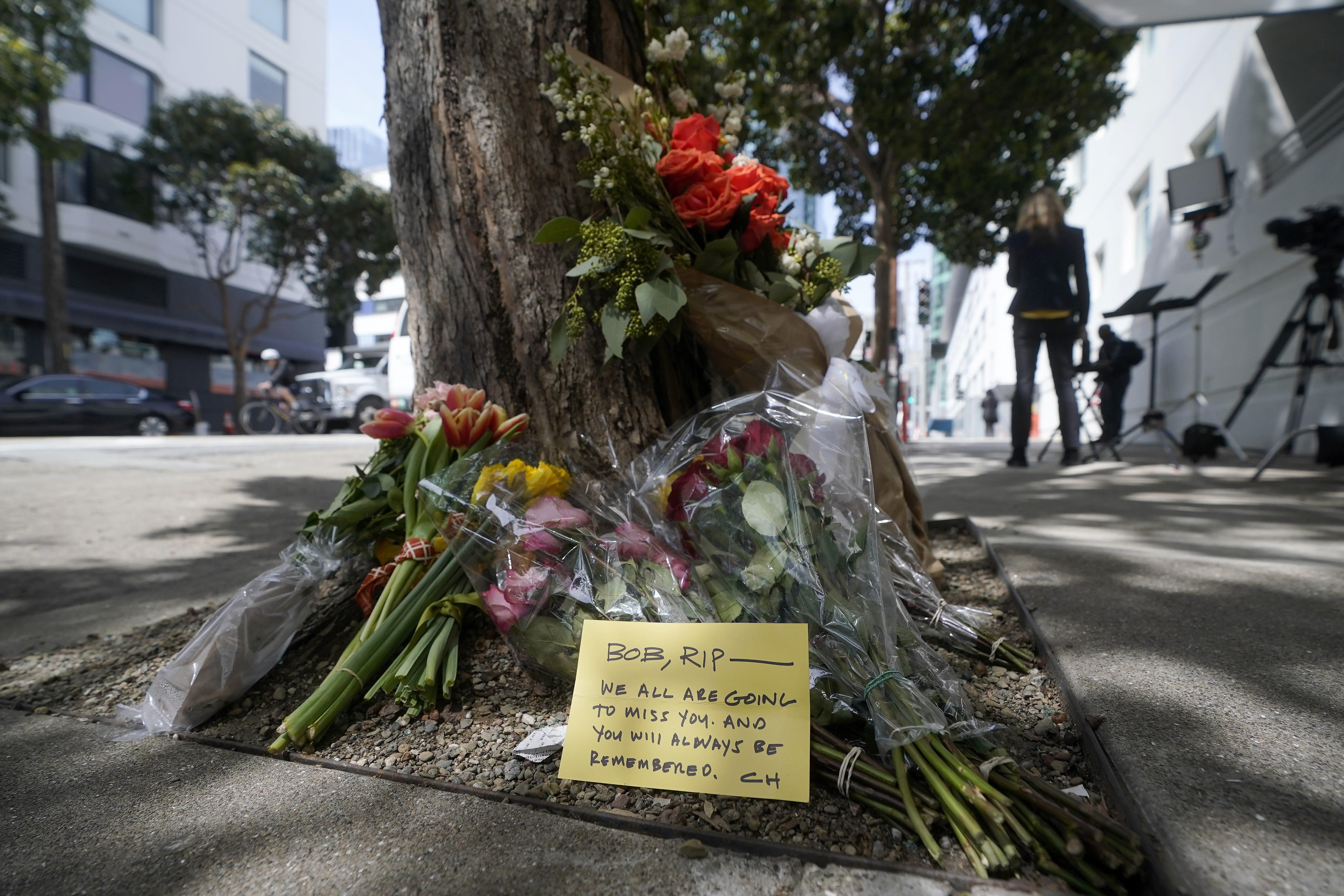 Flowers at a tree in front of the building where a technology executive was fatally stabbed near San Francisco, April 6. Details of how tech executive Bob Lee came to be fatally stabbed in downtown San Francisco early Tuesday were scarce as friends and family continued to mourn the man they called brilliant, kind and unlike others in the industry. 