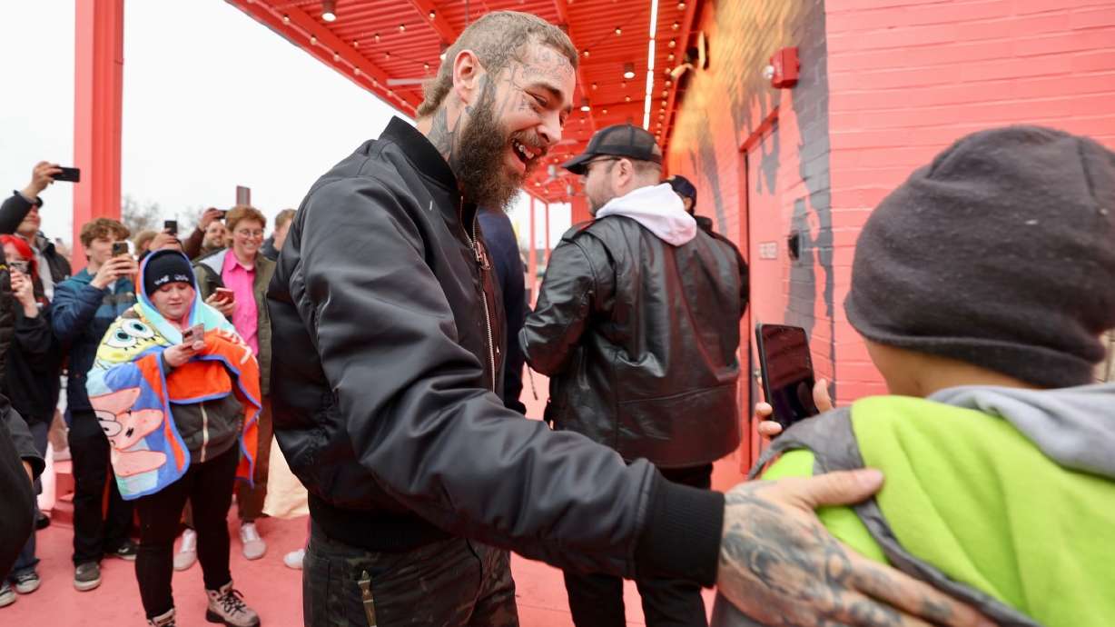 Post Malone greets fans at Raising Cane's in Midvale on April 12, 2023. He'll co-headline a New Year's Eve event in Salt Lake City, Smith Entertainment Group announced on Wednesday.