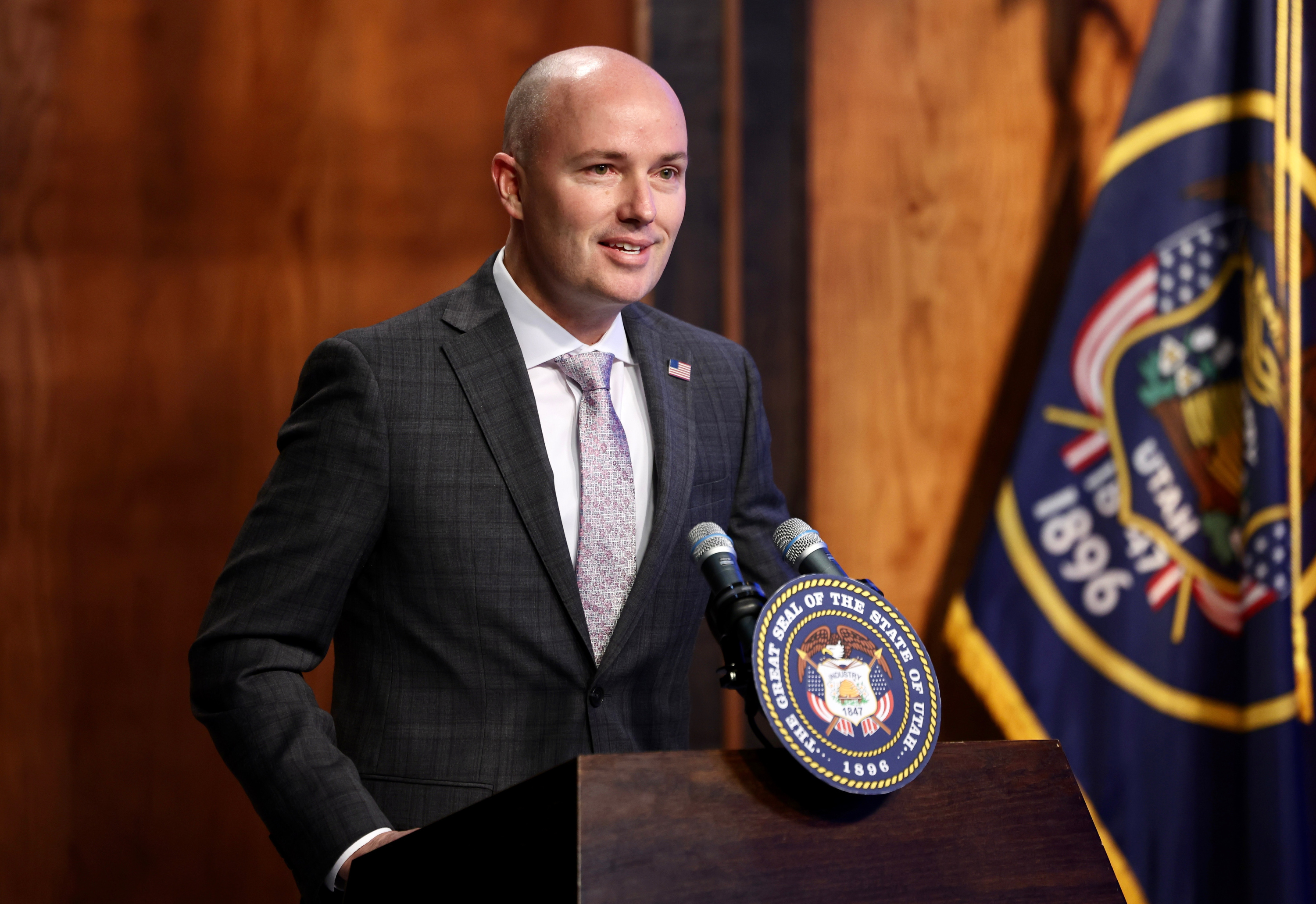 Gov. Spencer Cox holds a news conference in Salt Lake City, March 16. On Thursday, Cox praised a recent report that named Utah as the state with the best economic outlook for the 16th straight year.
