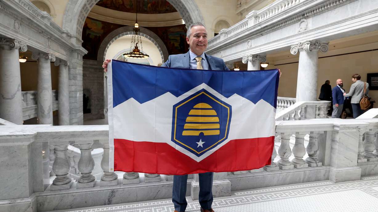 Sen. Daniel McCay, R-Riverton, sponsor of SB31, poses with the new Utah state flag at the Capitol in Salt Lake City on March 2. State officials said Thursday that an attempt to send the bill to a referendum did not get enough signatures to move forward.