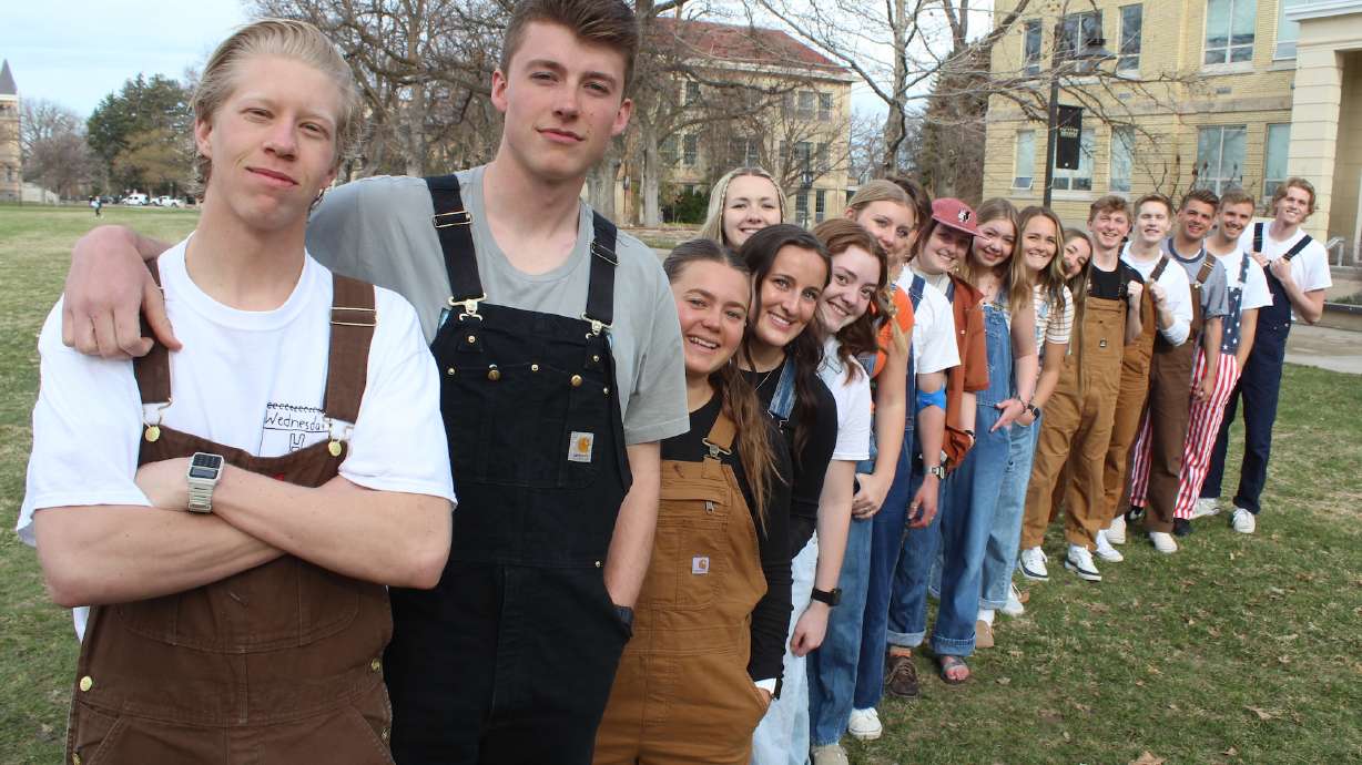 "Overall Wednesday" founders Parker Norton and Jaxon Hunt pose with a group of observers of the day at Utah State University.