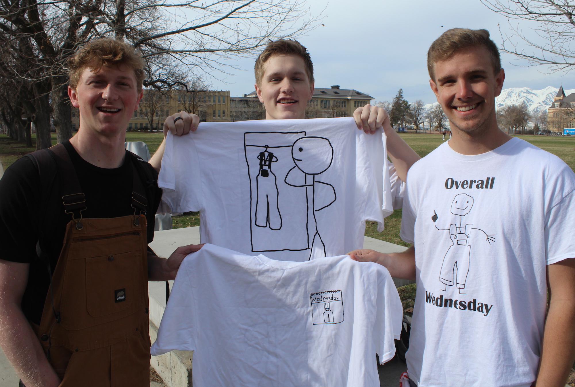 Overall Wednesday fans at Utah State University in Logan pose with T-shirts the group created and sold to mark the growing movement.