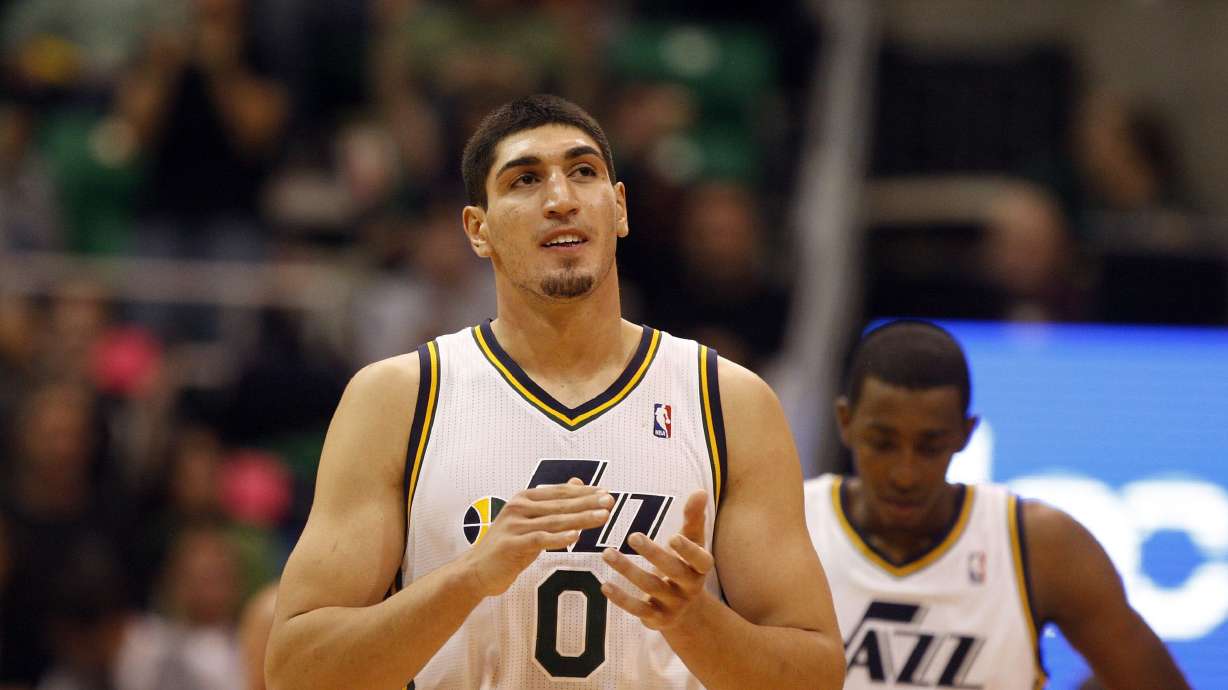 Enes Kanter applauds after the Utah Jazz defeats the Portland Trailblazers 92-89 in pre-season NBA basketball Dec. 21, 2011, in Salt Lake City. Freedom returned to the state Wednesday to be honored for his activism.