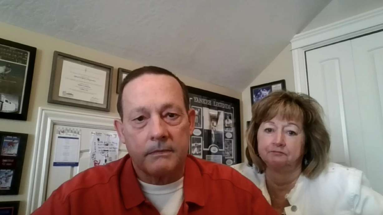Jim Calentino and his wife, Elizabeth, listen to his doctors talk about his successful triple organ transplant during a virtual press conference on Friday.
