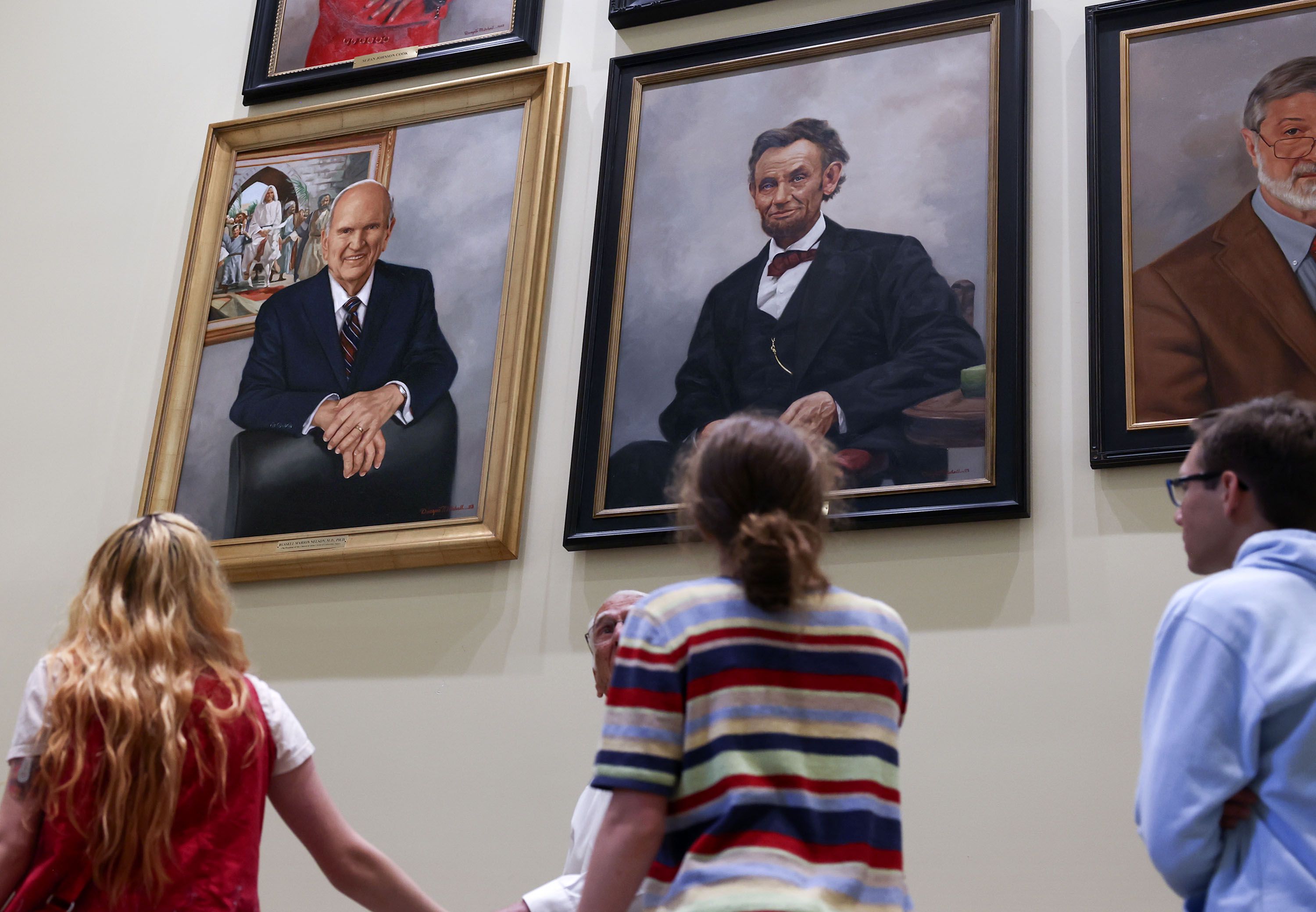 An oil portrait of President Russell M. Nelson of The Church of Jesus Christ of Latter-day Saints, left, hangs in the International Hall of Honor with Abraham Lincoln and Dr. Ira Helfand at the Martin Luther King Jr. International Chapel at Morehouse College in Atlanta on Thursday.