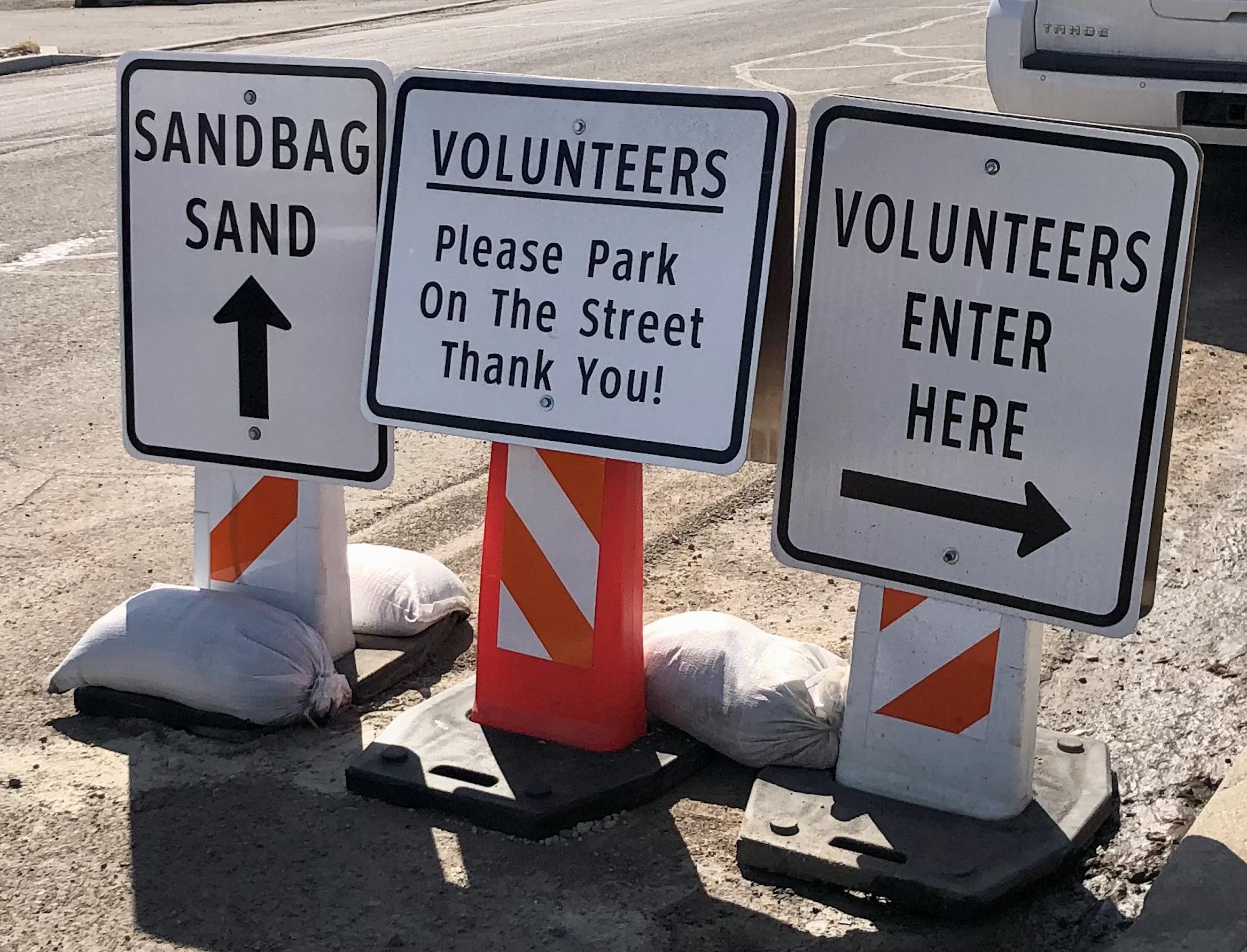 Signs outside the Provo public works yard show volunteers where to come fill sandbags on Friday, April 14, 2023. Lt. Gov. Deidre Henderson, Provo City Mayor Michelle Kaufusi and local legislators are calling on Provo residents to get involved in flood mitigation efforts.