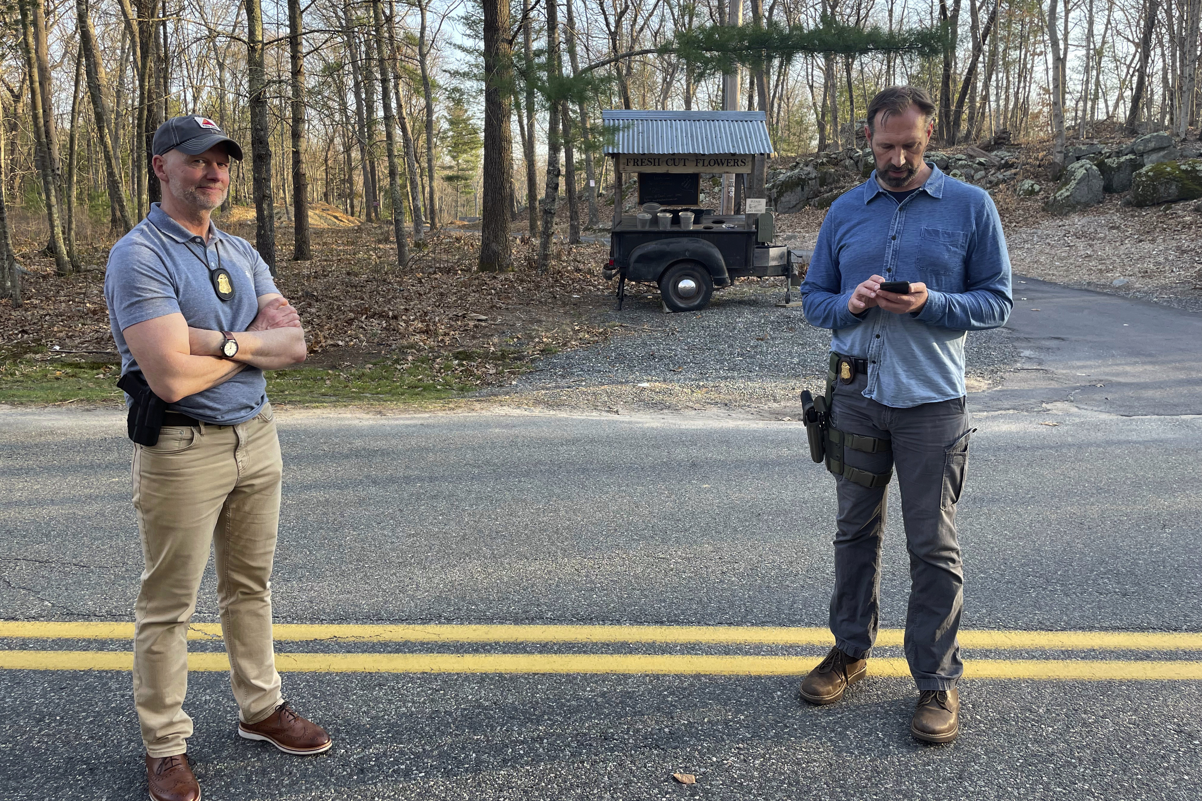 FBI officials guard the driveway where Jack Teixeira, a Massachusetts Air National Guard member, was taken into custody in Dighton, Mass., Thursday. Teixeira, 21, was arrested Thursday in connection with the disclosure of highly classified military documents about the Ukraine war and other top national security issues.