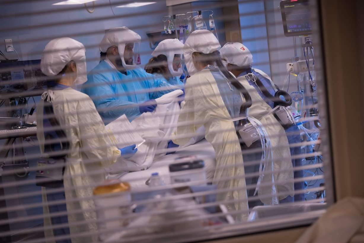 University of Utah Health workers treat patients inside the medical intensive care unit at University of Utah Hospital on July 30, 2021.