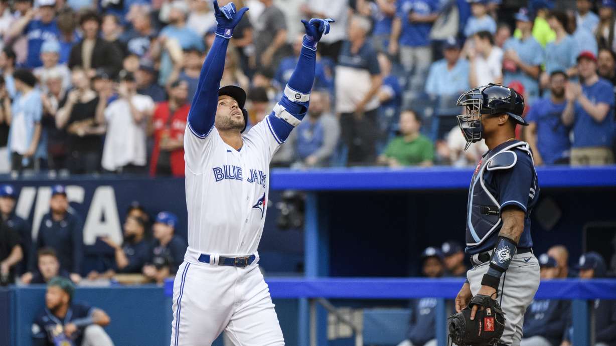 Toronto Blue Jays' George Springer celebrates after hitting a solo home run against the Tampa Bay Rays during the first inning of a baseball game Friday, April 14, 2023, in Toronto.
