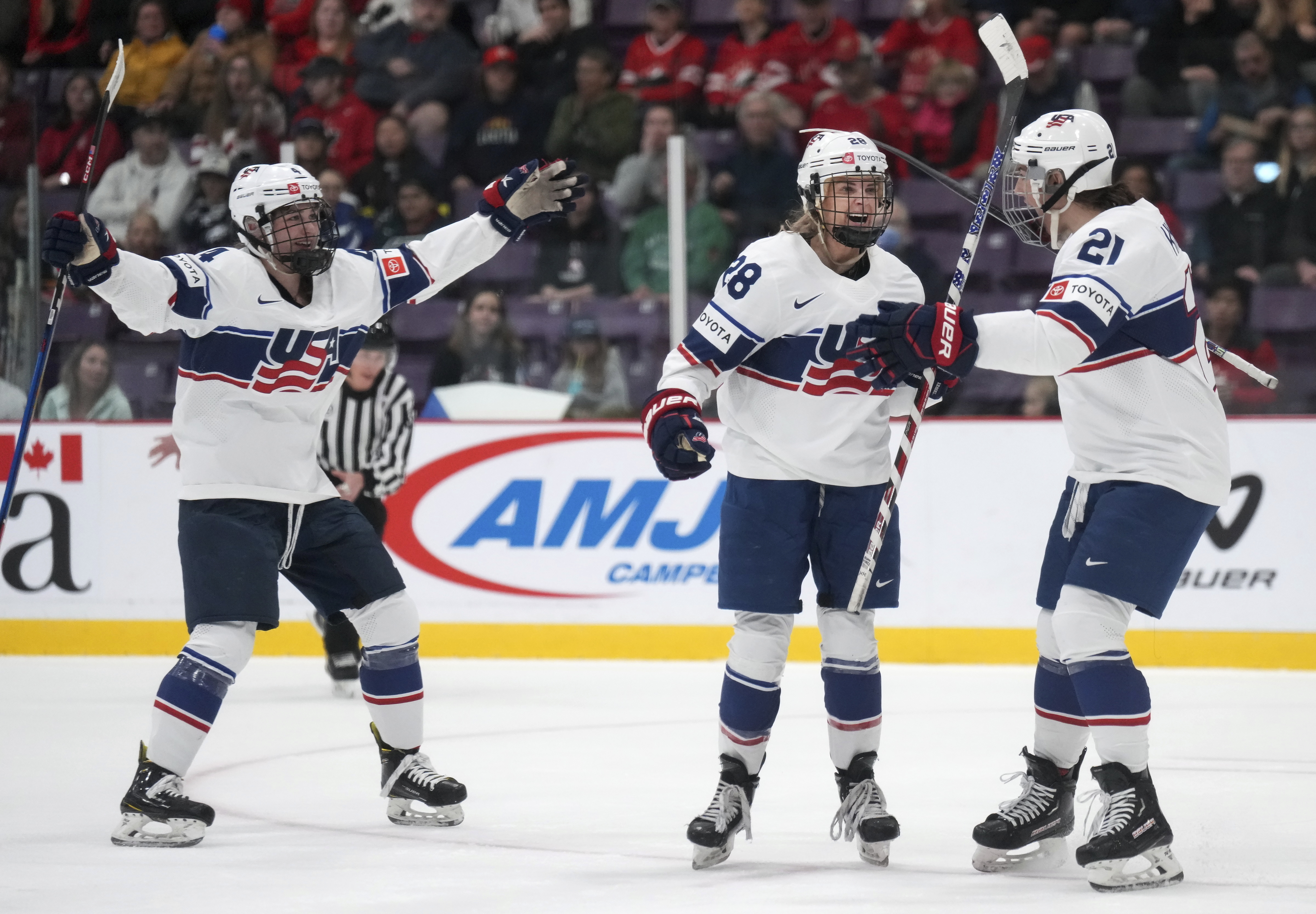 United States forward Amanda Kessel (28) celebrates her goal with teammates Hilary Knight (21) and Caroline Harvey (4) during the first period against the Czech Republic in the semifinals of the women's world hockey championships in Brampton, Ontario, Saturday, April 15, 2023.