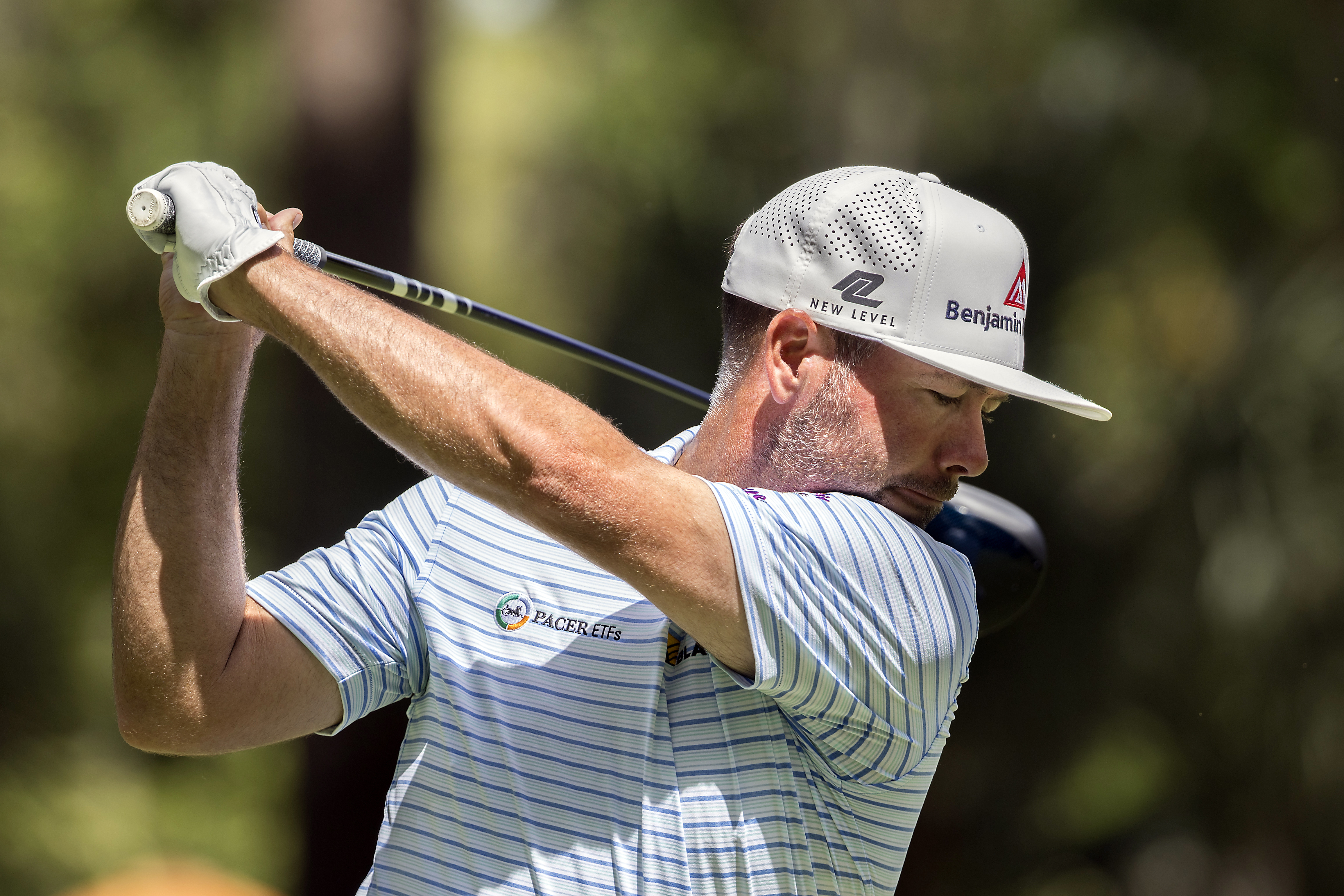 Chez Reavie hits off the eighth tee during the third round of the RBC Heritage golf tournament, Saturday, April 15, 2023, in Hilton Head Island, S.C. 