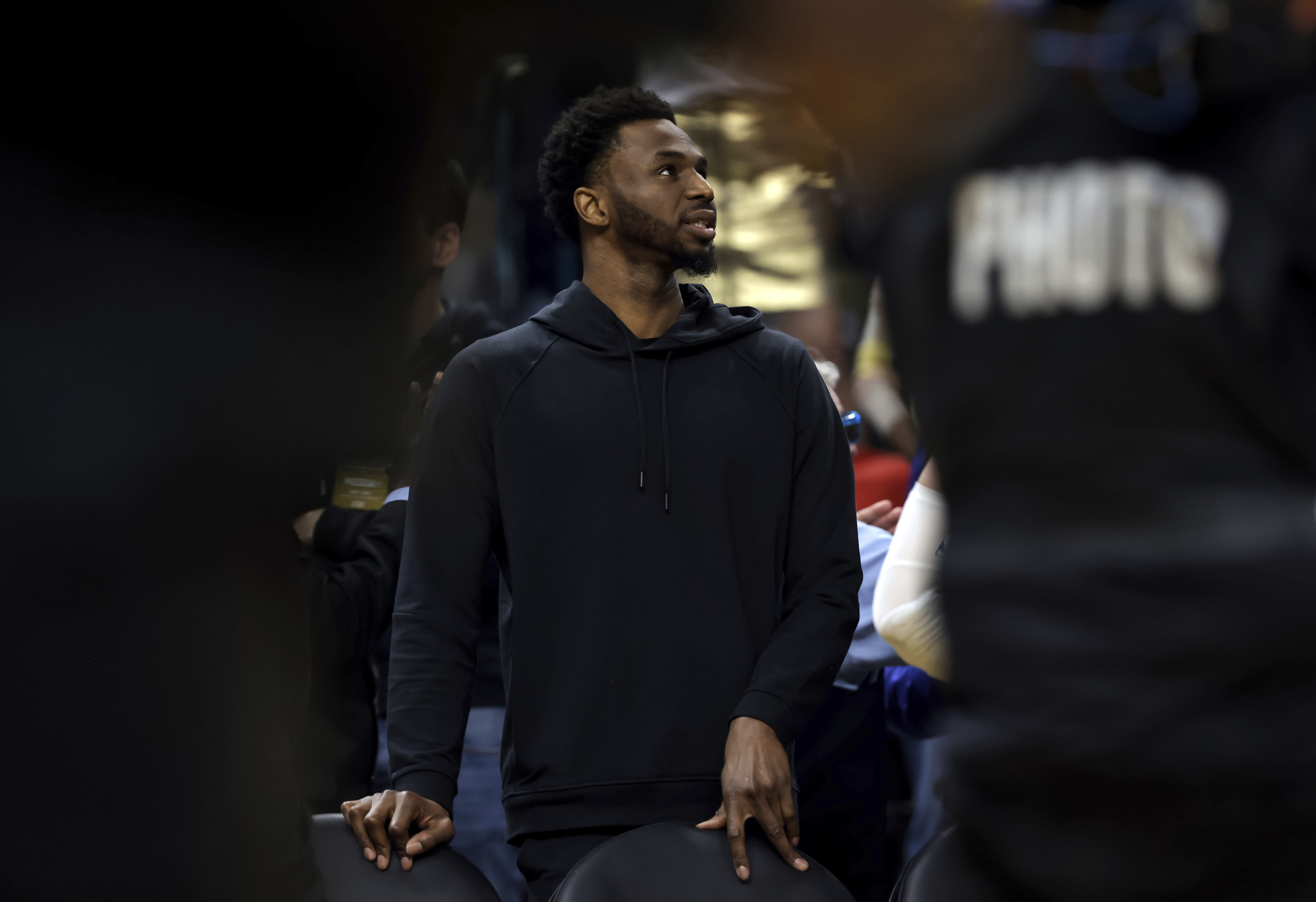 Andrew Wiggins waits at the bench during a timeout in the second half as the Golden State Warriors played the Oklahoma City Thunder at Chase Center in San Francisco, on Tuesday, April 4, 2023. 