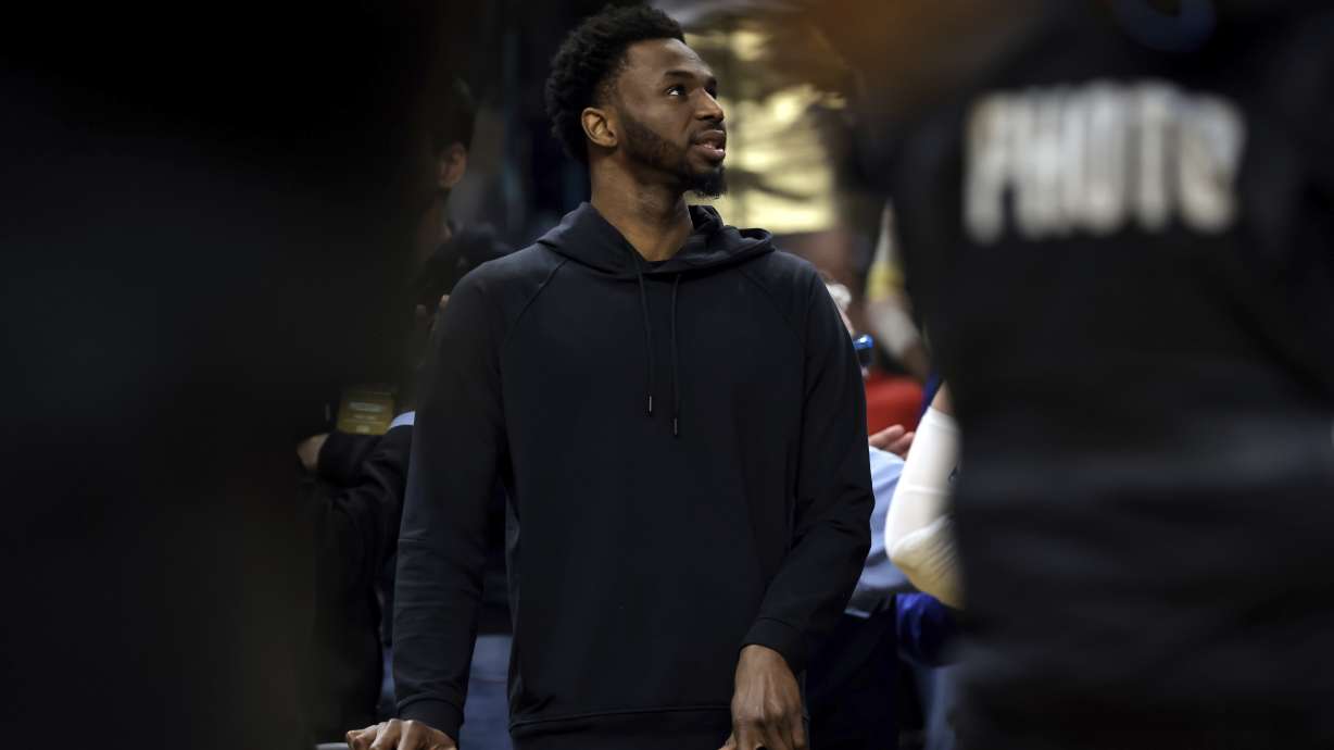 Andrew Wiggins waits at the bench during a timeout in the second half as the Golden State Warriors played the Oklahoma City Thunder at Chase Center in San Francisco, on Tuesday, April 4, 2023.