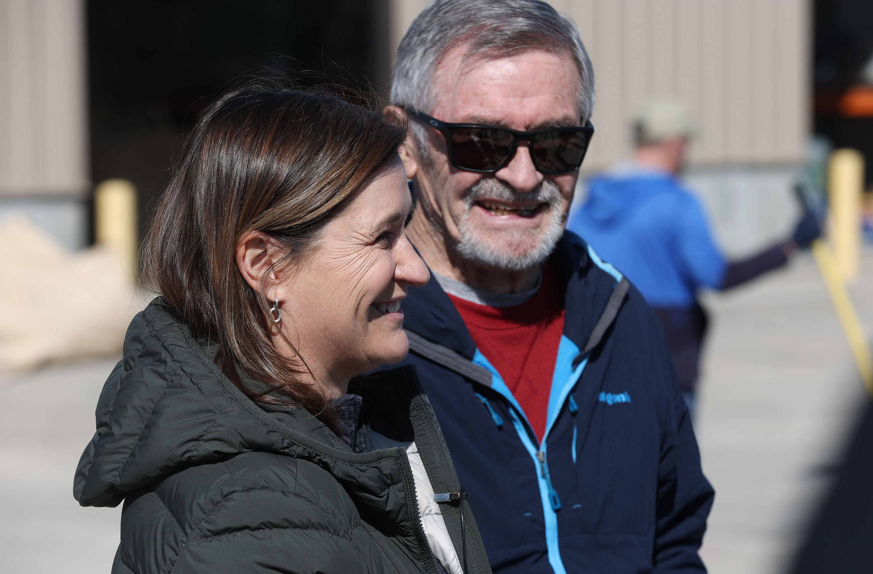 Salt Lake County Mayor Jenny Wilson and former Salt Lake City Mayor Ted Wilson talk about volunteers assisting to fill sandbags in Midvale on March 17, 2023, as part of a two-day plan of action preparing for the spring runoff.
