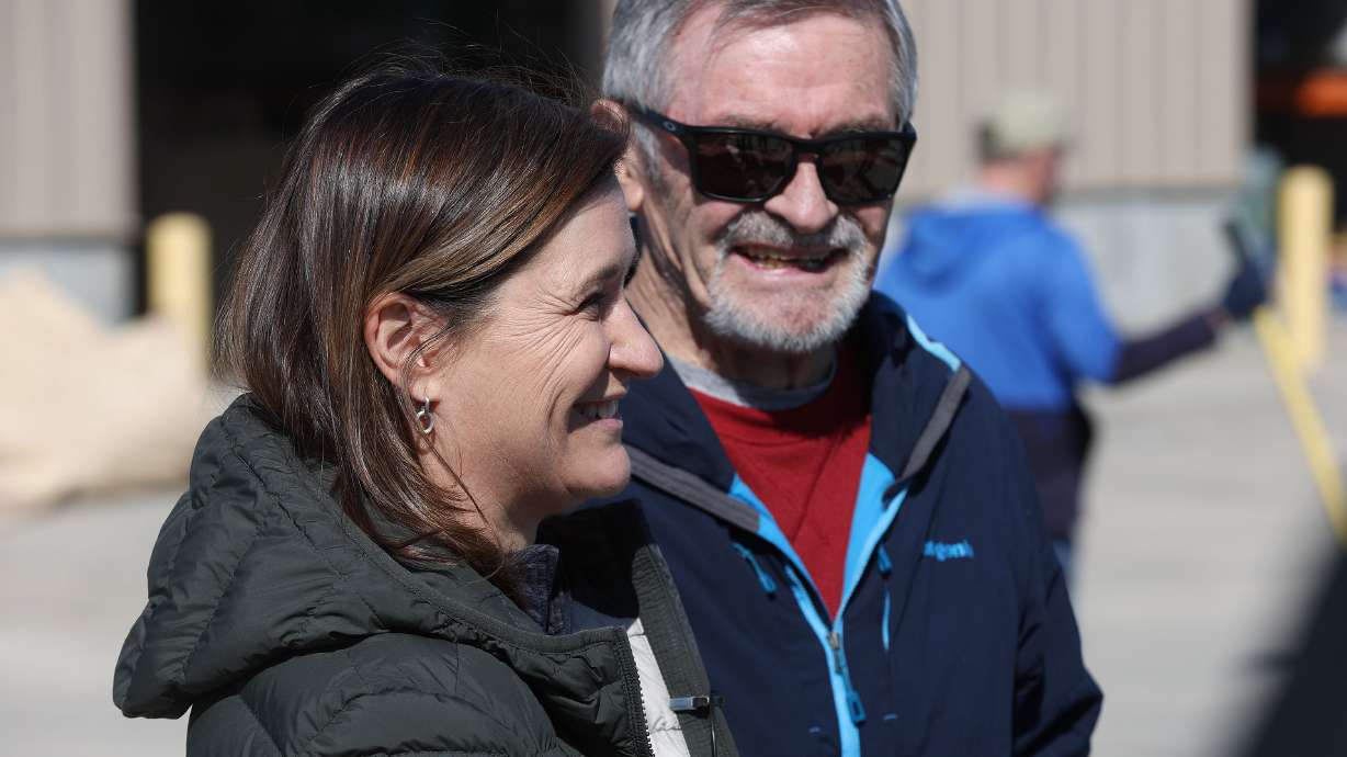Salt Lake County Mayor Jenny Wilson and former Salt Lake City Mayor Ted Wilson talk about volunteers assisting to fill sandbags in Midvale on March 17 as part of a two-day plan of action preparing for the spring runoff. The Wilsons have been integral in flood mitigation for 2023.