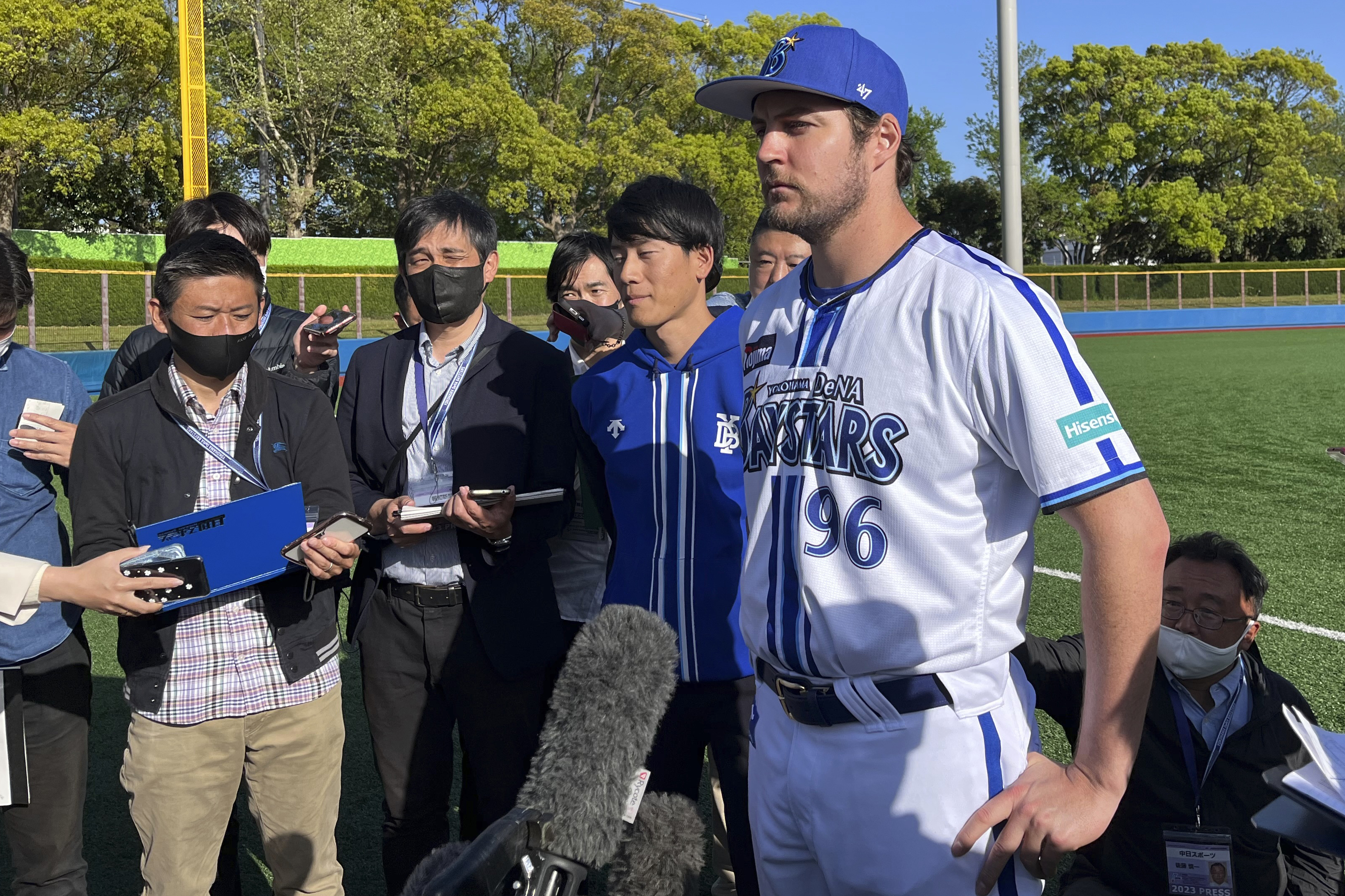 Yokohama BayStars Trevor Bauer is surrounded by the reporters in Yokosuka, Japan, Sunday, April 16, 2023. Bauer pitched four innings Sunday for the Yokohama BayStars minor league team in Yokosuka as he prepares to pitch his first game for the Yokohama team. 