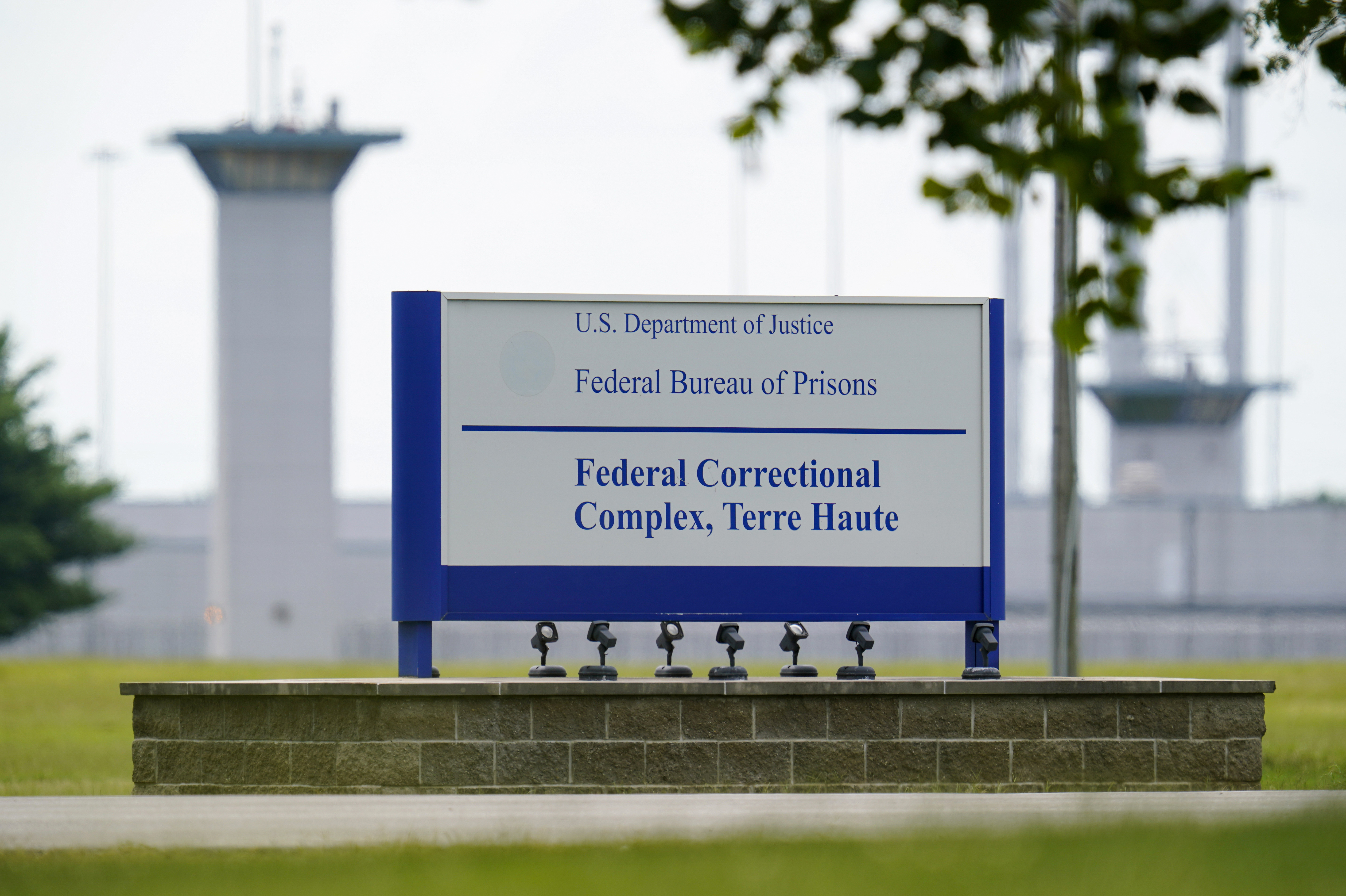 The Justice Department hasn't authorized an inmate's transfer to a less restrictive prison unit despite his death sentence being vacated by a judge.
