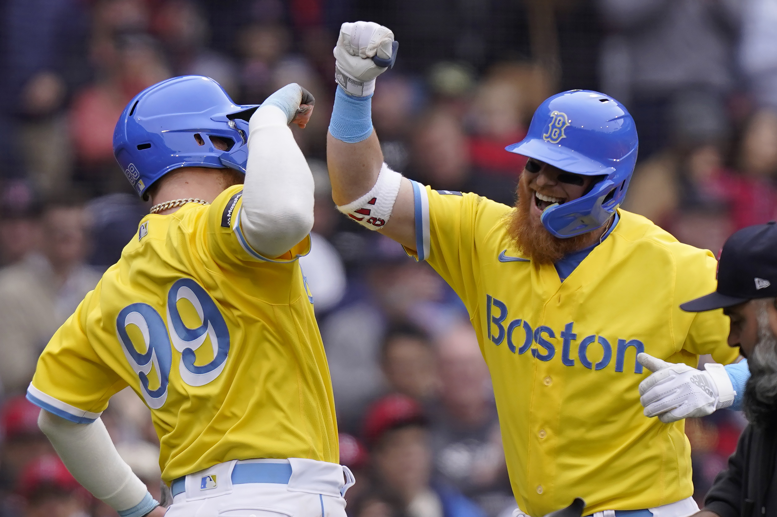 Boston Red Sox's Alex Verdugo (99) celebrates with Justin Turner as Turner arrives at home plate after hitting a two-run home run in the third inning of a baseball game against the Los Angeles Angels, Sunday, April 16, 2023, in Boston.