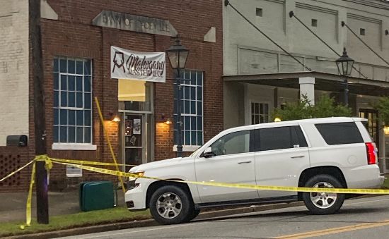 Investigators work at the site of a fatal shooting in downtown Dadeville, Alabama, on Sunday. Several were killed during a shooting at a birthday party Saturday night, the Alabama Law Enforcement Agency said.