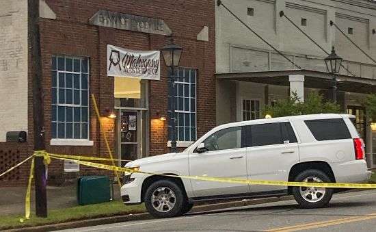 Investigators work at the site of a fatal shooting in downtown Dadeville, Alabama, on Sunday. Several were killed during a shooting at a birthday party Saturday night, the Alabama Law Enforcement Agency said.
