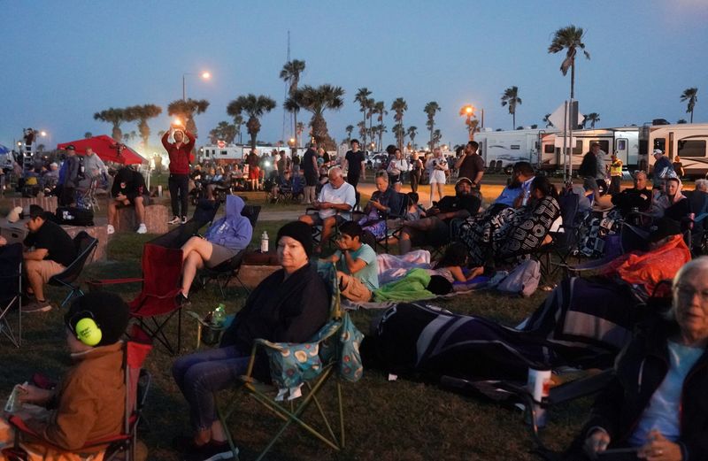 People gather before SpaceX's Starship lifts off from the company's Boca Chica launchpad on an orbital test mission near Brownsville, Texas, Monday. SpaceX called off the launch.
