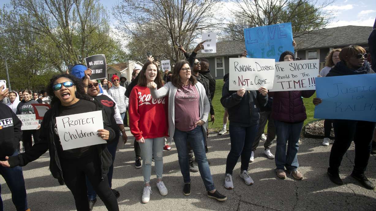 Protestors march Sunday, in Kansas City, Mo., to bring attention to the shooting of Ralph Yarl, 16, who was shot when he went to the wrong Kansas City house to pick up his brothers.