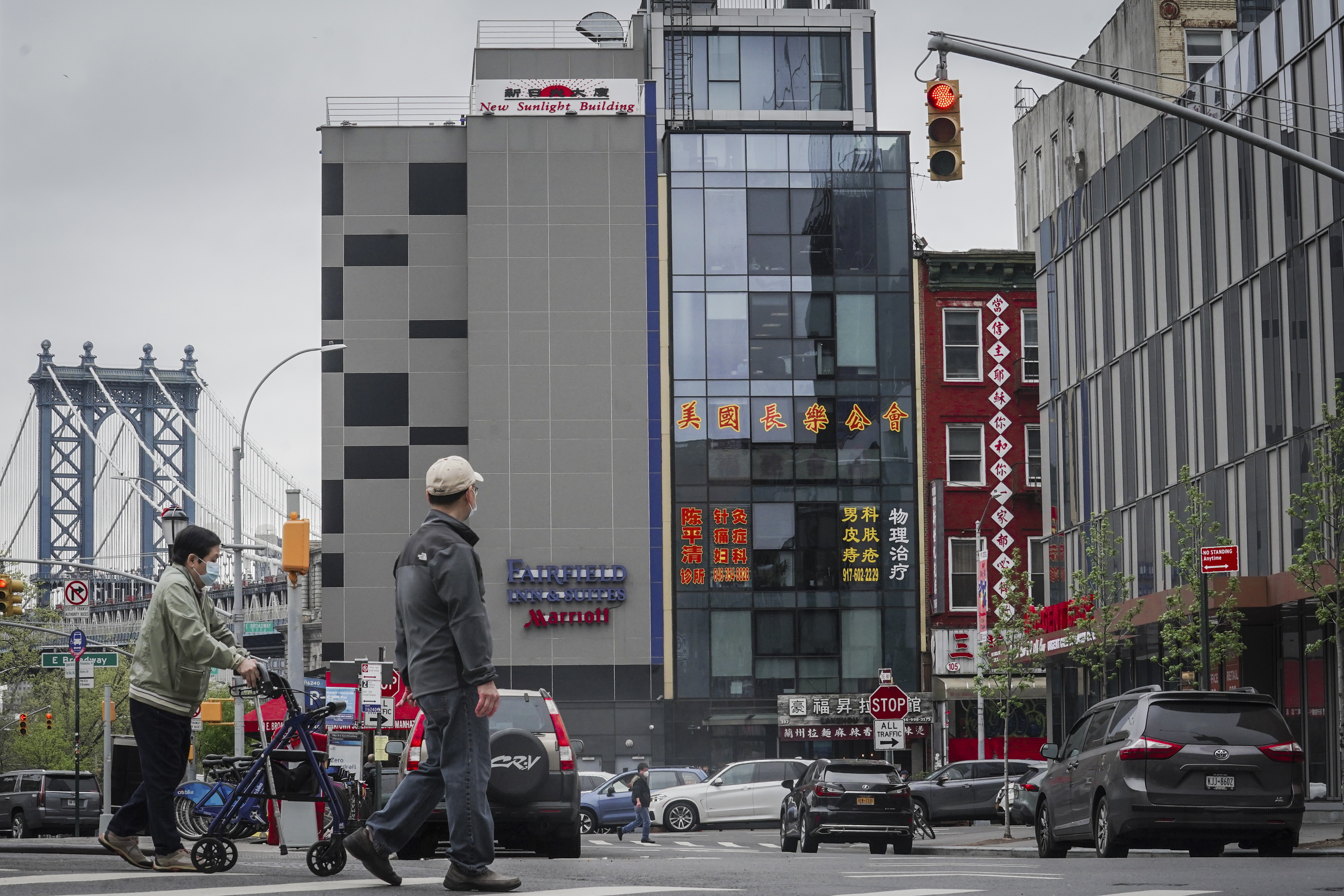 A six-story glass facade building, center, is believed to be the site of a foreign police outpost for China in New York, Monday. Justice Department officials say two men have been arrested on charges they helped establish a secret police outpost on behalf of the Chinese government. 