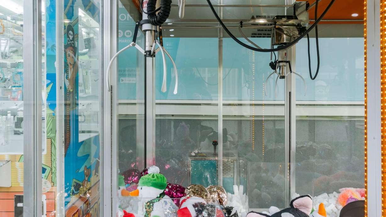 A 13-year-old boy had to be freed from a claw machine after he climbed inside hoping to score a prize, according to an official at a North Carolina amusement park.